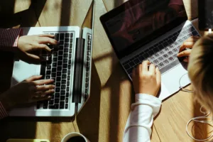A workspace with a laptop and business apps on the screen.