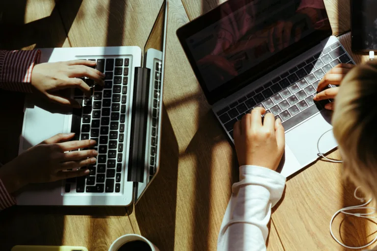 A workspace with a laptop and business apps on the screen.